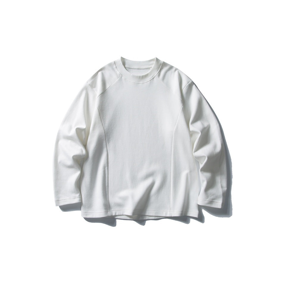 White long-sleeve crew neck top with raglan sleeves and vertical front seams, flat lay on white background
