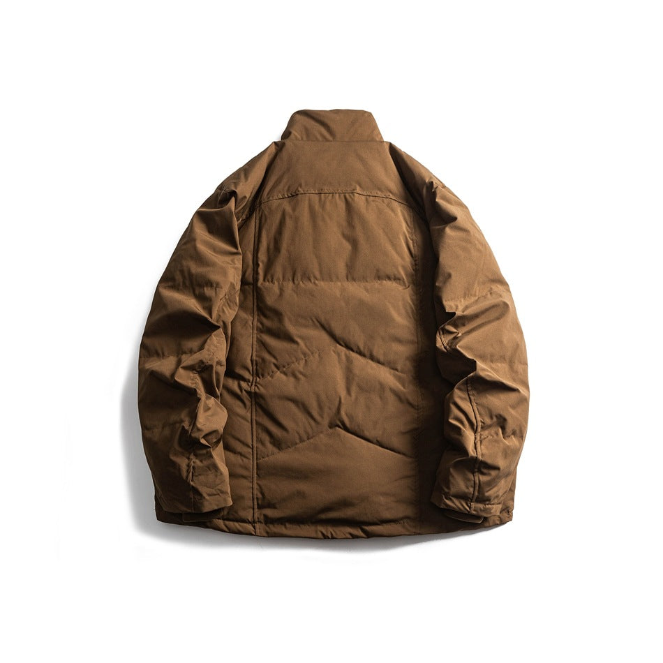 Back view of brown quilted stand-collar puffer jacket with chevron quilting, flat lay