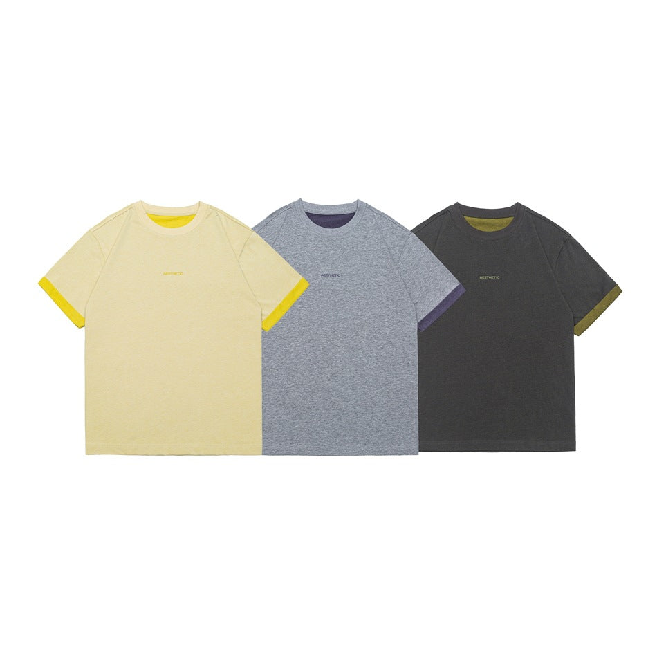 Three short-sleeve crew-neck T-shirts shown from the front in pale yellow, gray melange, and charcoal, with contrast trim.