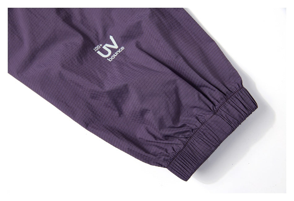 Purple jacket sleeve with an elastic cuff and a small white UV print.