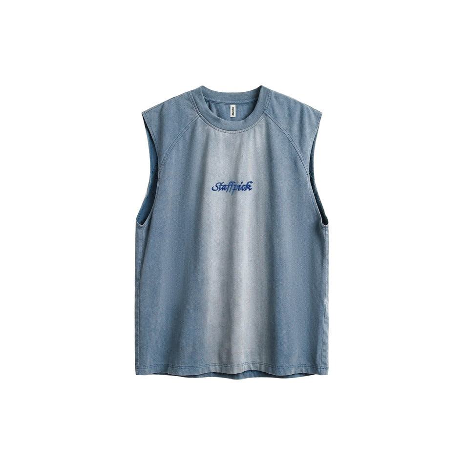 Washed blue sleeveless crew-neck top with raglan shoulder seams and blue embroidered chest lettering, flat lay front view