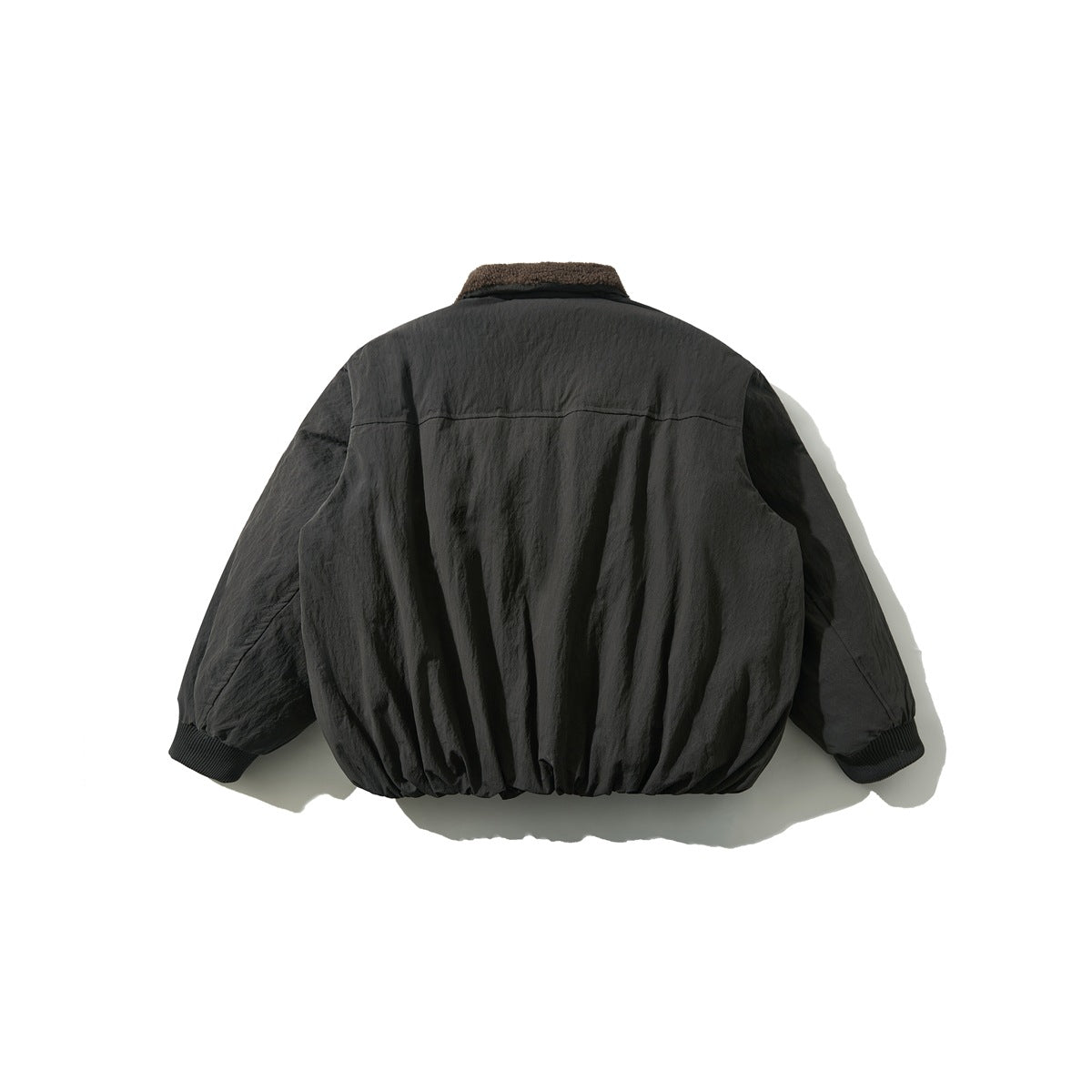 Back view of a dark jacket with a brown textured collar, gathered hem, and ribbed cuffs.