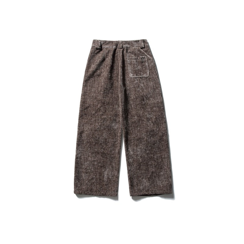 Back view of brown textured wide-leg trousers with belt loops and a single patch pocket.