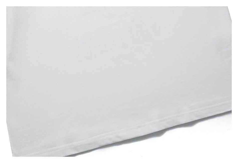 Close-up of the straight double-stitched hem on a white shirt.