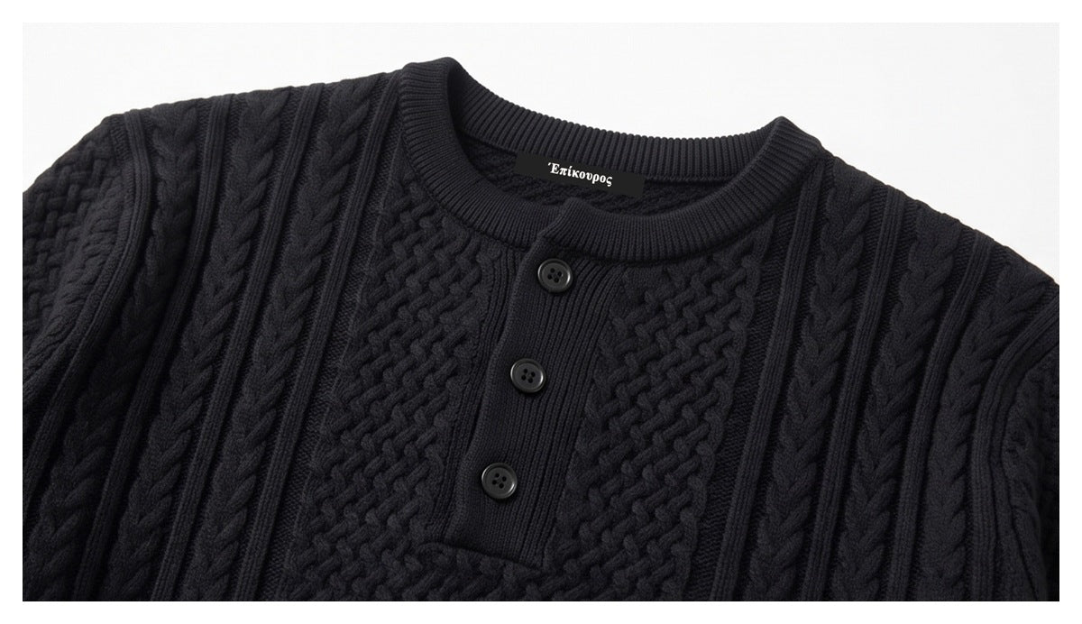 Close-up of a black sweater's ribbed crew neck, three-button placket, and textured knit panels.