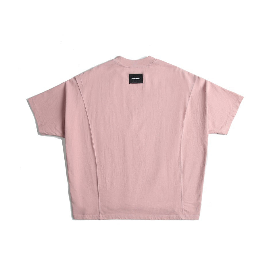 Pink short-sleeve T-shirt back view with curved panel seams, high ribbed neck and small black label