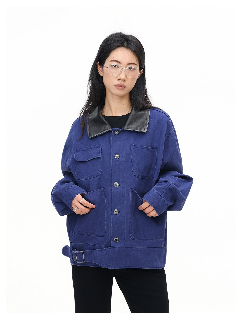 Woman wearing a blue button-front jacket with black collar and patch pockets, hands in lower pockets, front view