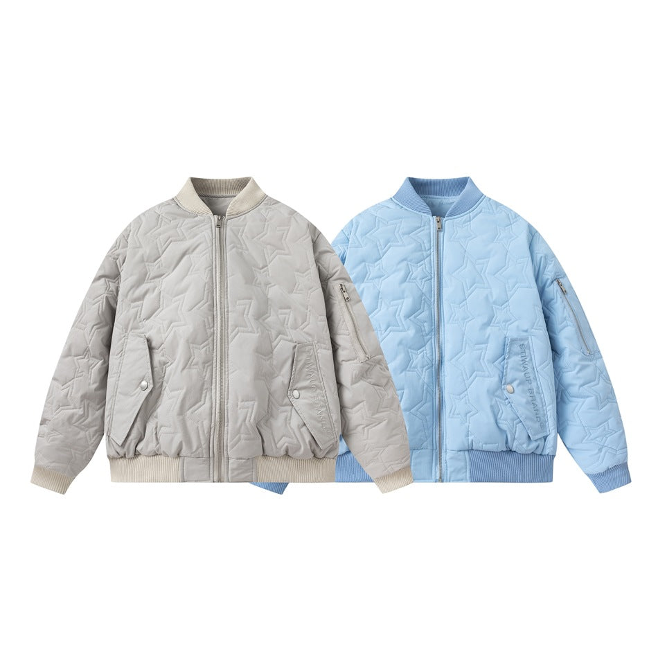 Two star-quilted zip-front jackets shown side by side in light gray and pale blue, with ribbed trims and pockets.