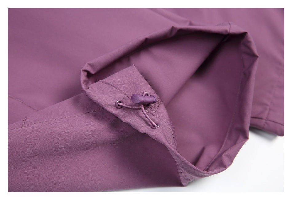 Close-up of purple trousers with an adjustable drawcord and toggle at the hem.