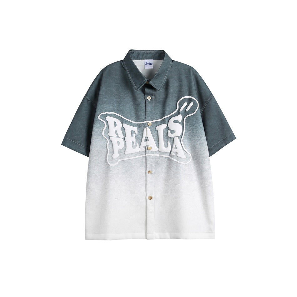 Black-gray gradient short-sleeve button-up shirt with white puffy lettering graphic on the chest, flat front view