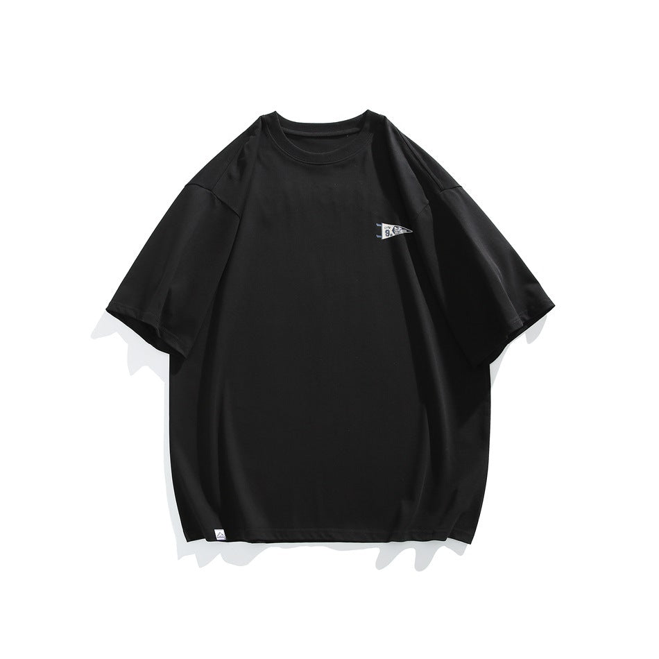 Front view of a black oversized short-sleeve T-shirt with a small pennant graphic on the chest.