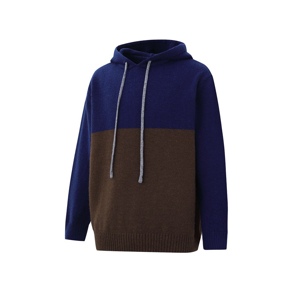 Front three-quarter view of a navy and dark brown color-block knit hoodie with a hood and light drawstrings.