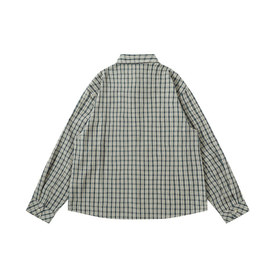 Back view of a beige and navy plaid long-sleeve button-up shirt laid flat.