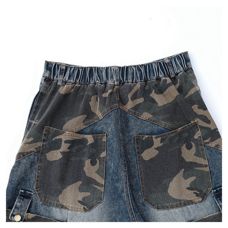 Cropped back view of denim pants with a gathered waistband and two camouflage-print patch pockets.