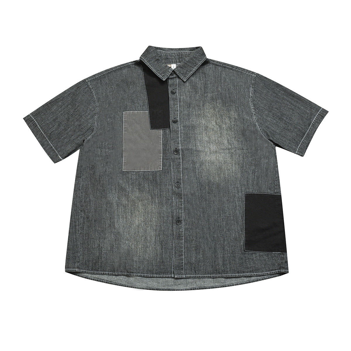 Gray washed denim-look short-sleeve button-up shirt with black and gray patchwork panels, flat lay front view