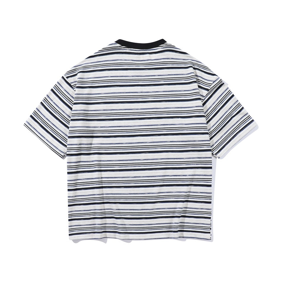 Back view of a white short-sleeve T-shirt with thin black, navy, and gray stripes and a black crew neck.