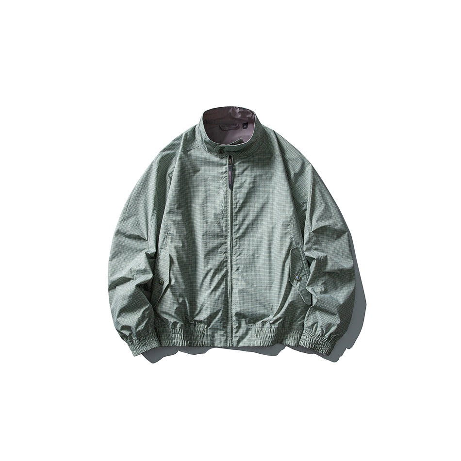 Celadon green checked stand-collar zip jacket flat lay with flap pockets and elastic hem