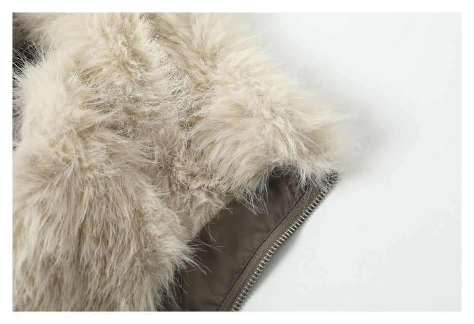 Close-up of pale, long-pile fur trim beside the taupe jacket zipper.