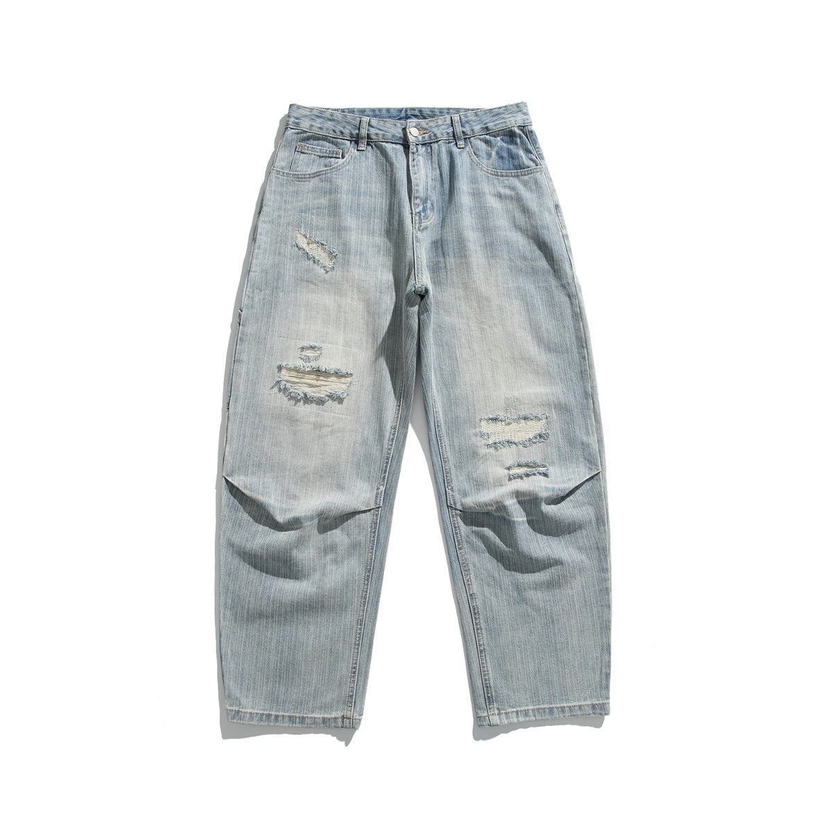 Light-blue washed distressed denim jeans flat lay, front view, with frayed rips on thighs and knees
