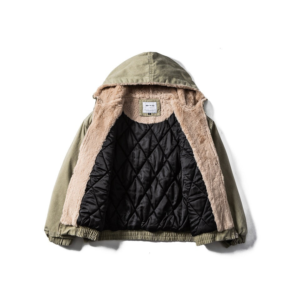 Olive hooded jacket opened to show plush tan lining around the hood and edges, plus black diamond-quilted lining.