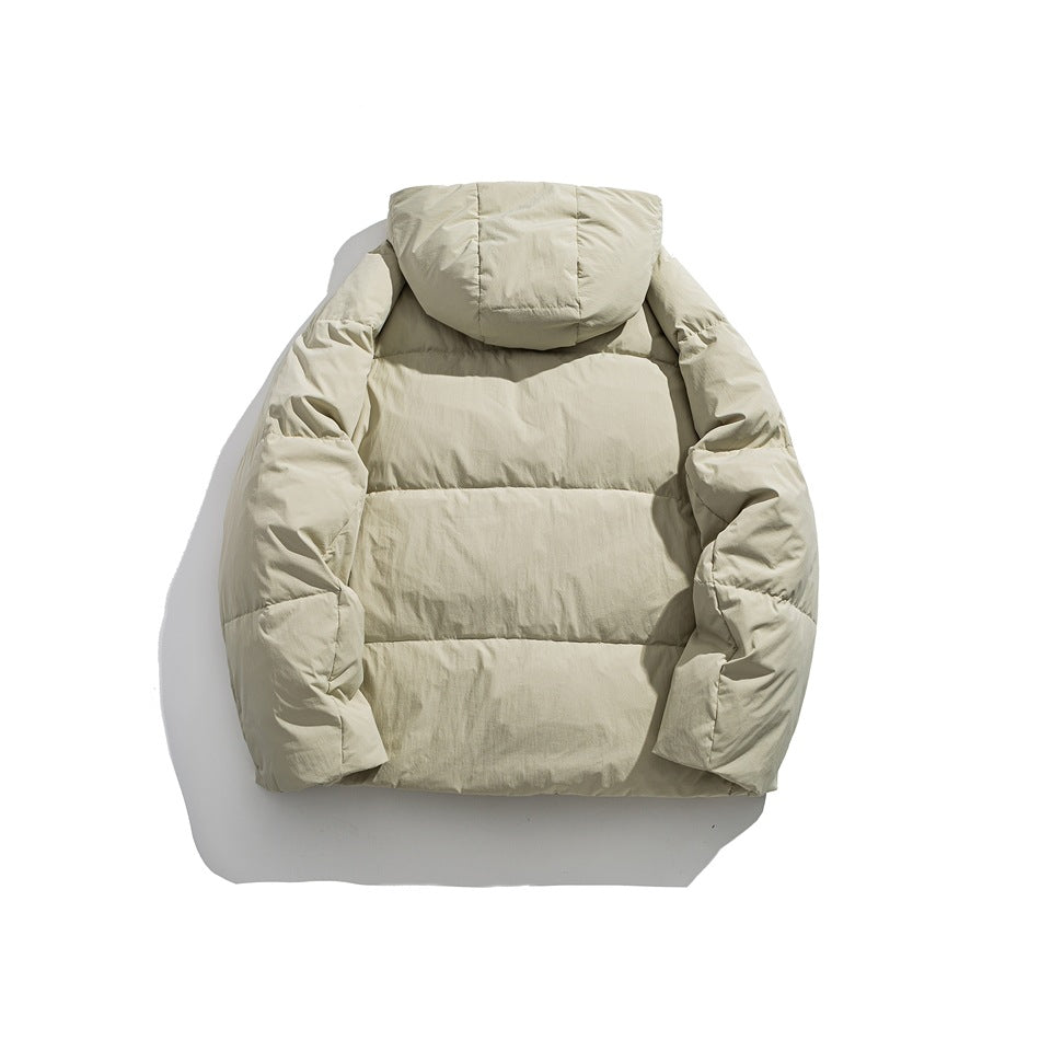 Back view of a light beige hooded puffer jacket laid flat against a white background.