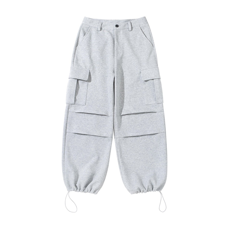Heather gray cargo pants flat lay with hem drawcords gathered, flap thigh pockets and knee pleats
