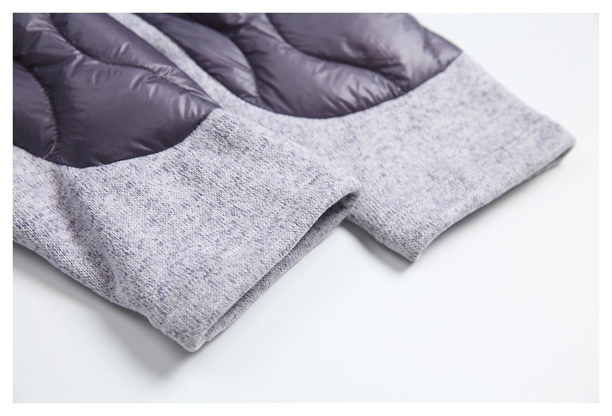 Close-up of the light gray heather jacket hem beside its dark quilted lining.