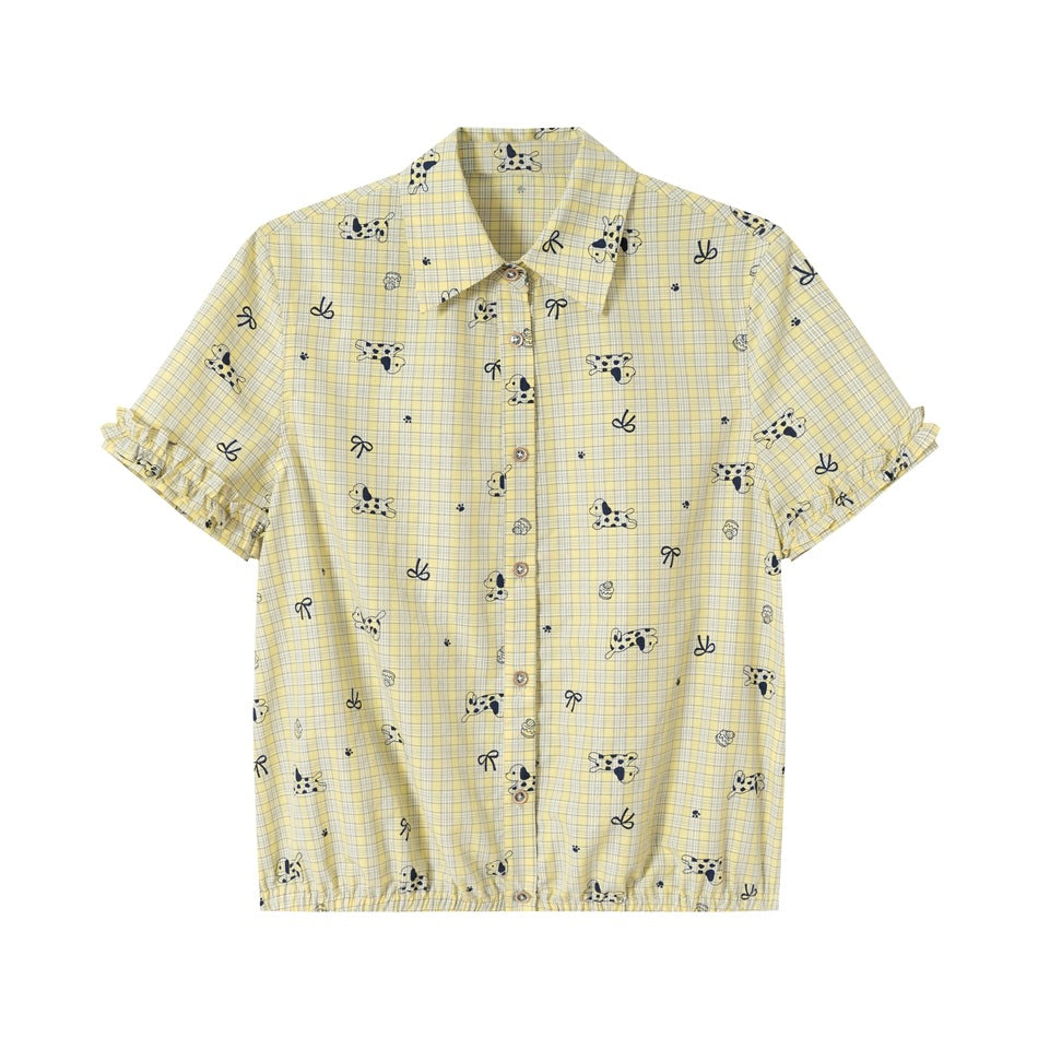 Pale yellow plaid short-sleeve button-front shirt with navy dog and bow print, ruffled cuffs and gathered hem, front view