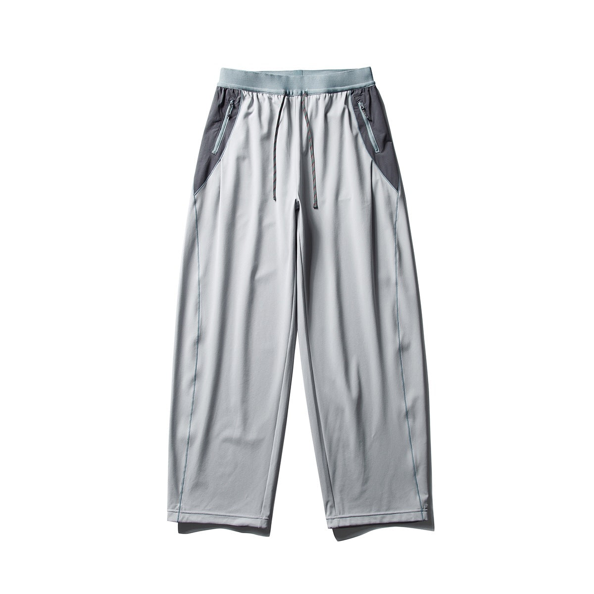 Light gray wide-leg pants with a gray ribbed waistband, dark gray side panels, zip pockets and drawstring, flat front view