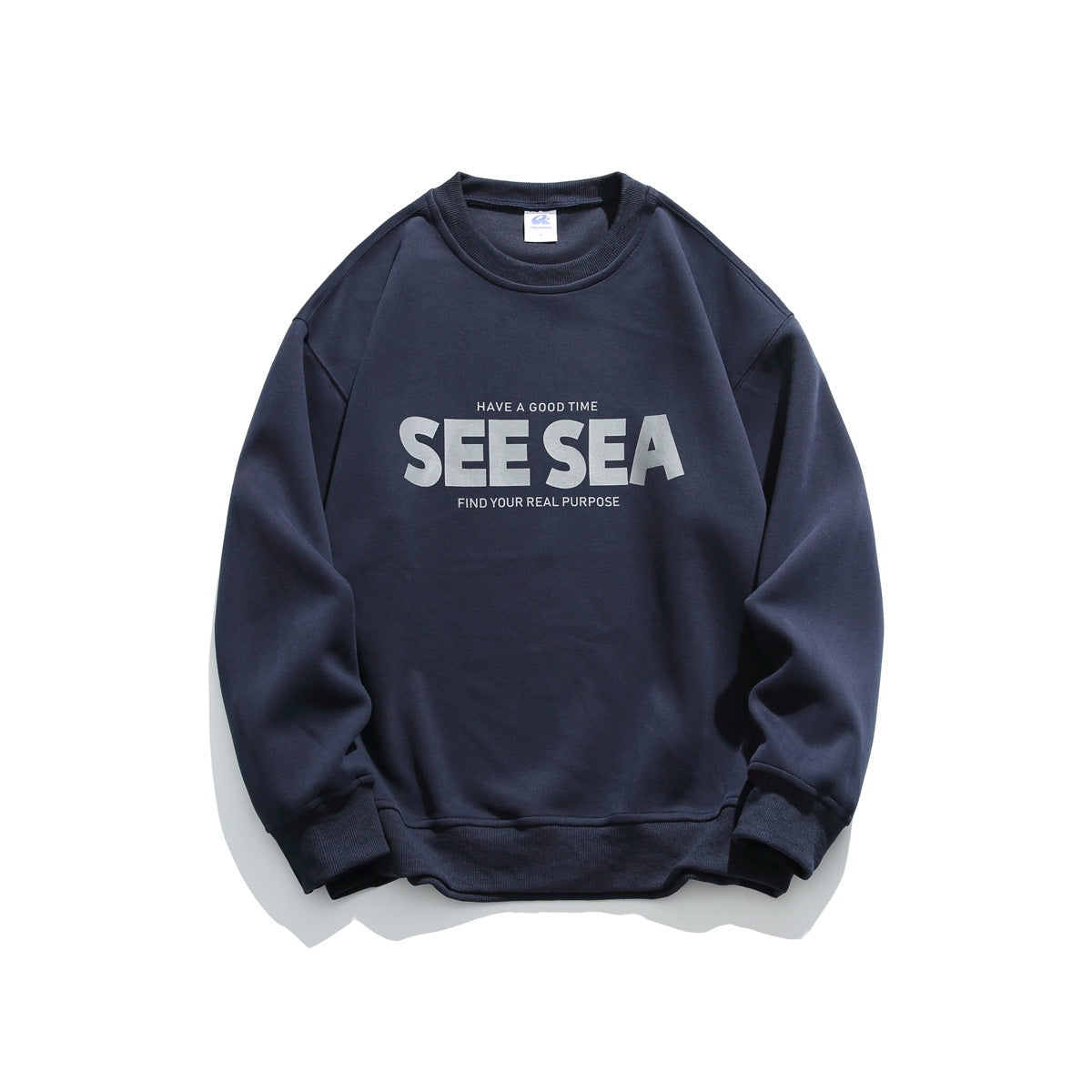 Navy crew-neck sweatshirt with gray 'SEE SEA' chest print, ribbed collar, cuffs and hem, flat lay