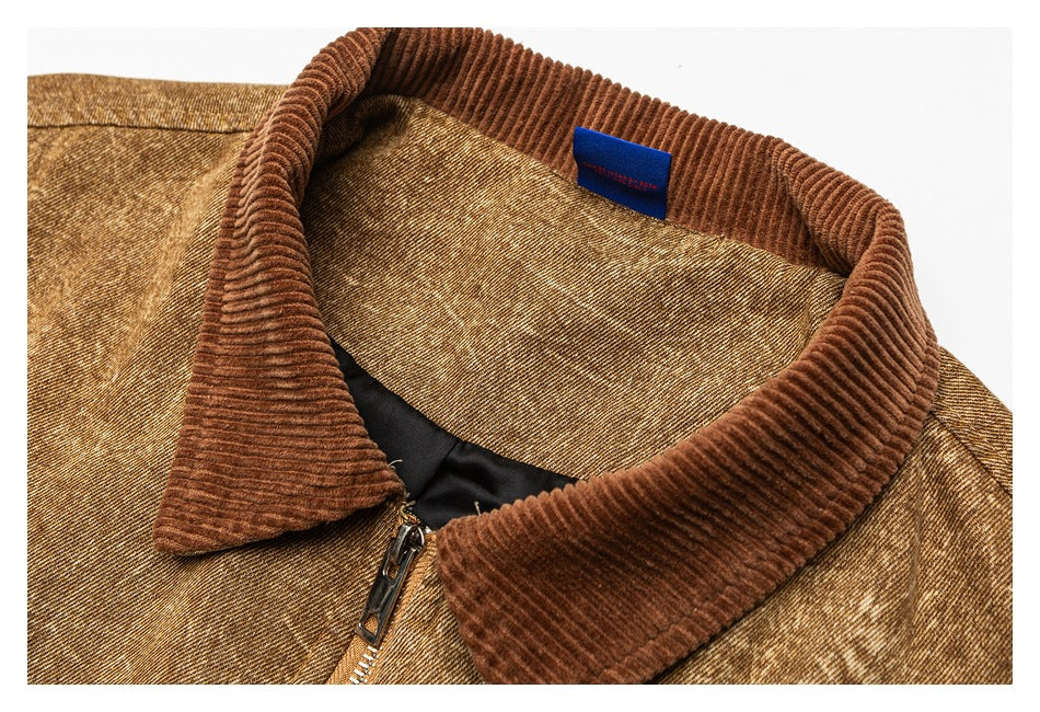 Close-up of the jacket's brown ribbed collar, zipper, inner lining, and small blue neck label.
