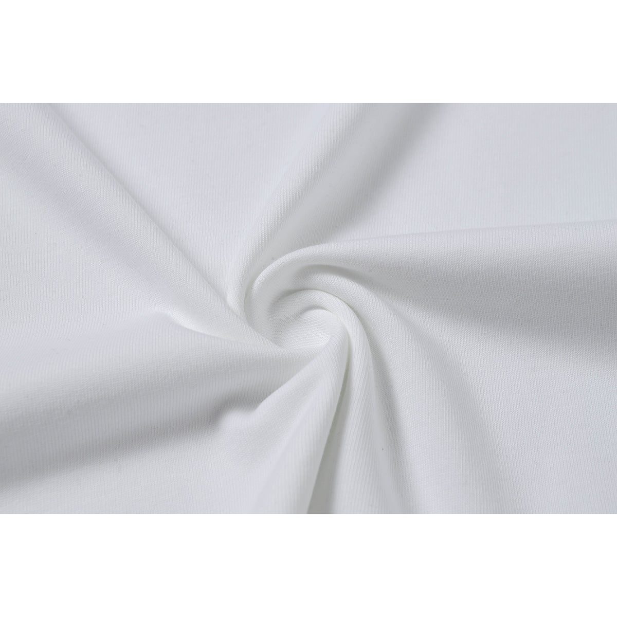 Close-up of white fabric gathered into a soft spiral fold.