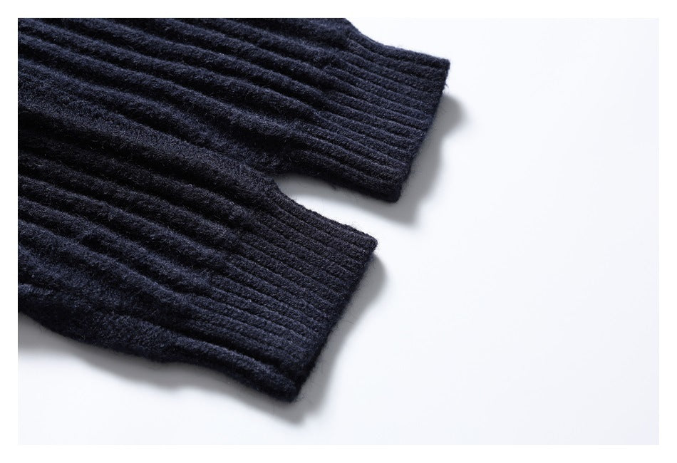 Close-up of the dark navy cardigan's ribbed sleeve cuffs and knit texture.
