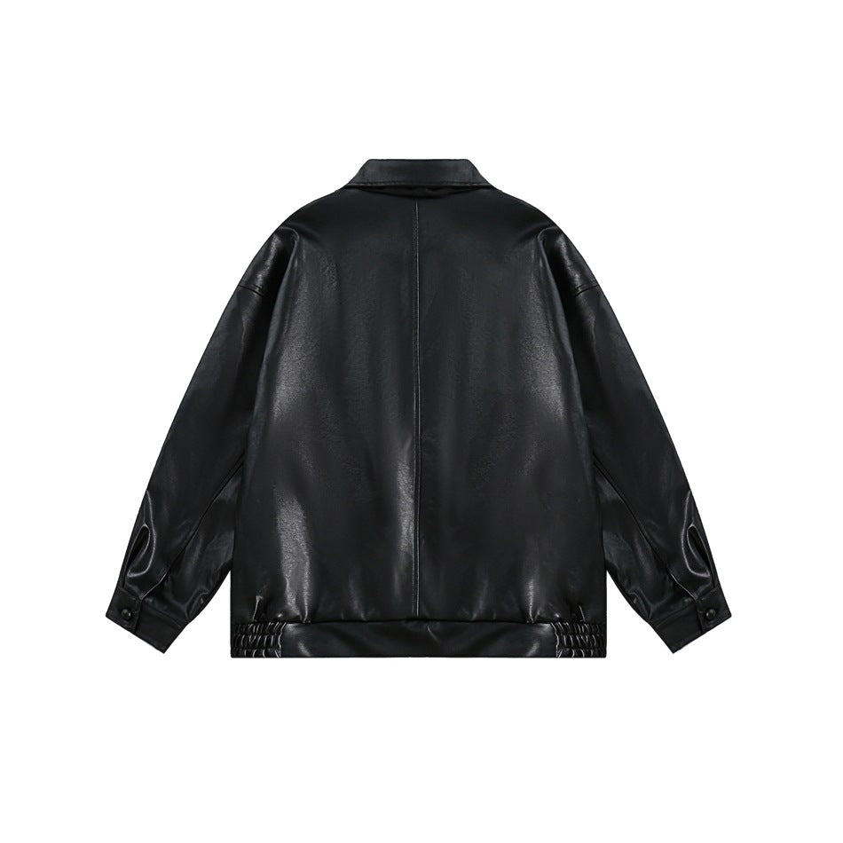 Back view of a black jacket with a center seam, button cuffs and gathered sections at the hem.