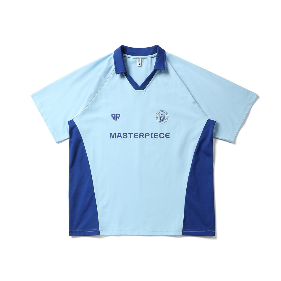 Light blue short-sleeve polo-collar jersey top with royal blue collar, side panels and chest print, flat front view