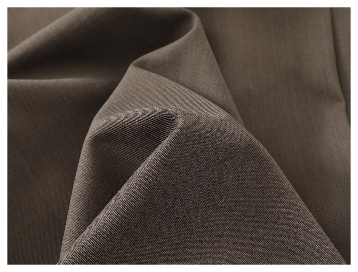 Close-up of taupe-gray fabric folded to show its fine surface texture.