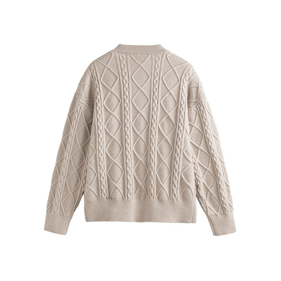 Back view of a cream cable-knit sweater with raised diamond and braided panels, ribbed collar, cuffs and hem.