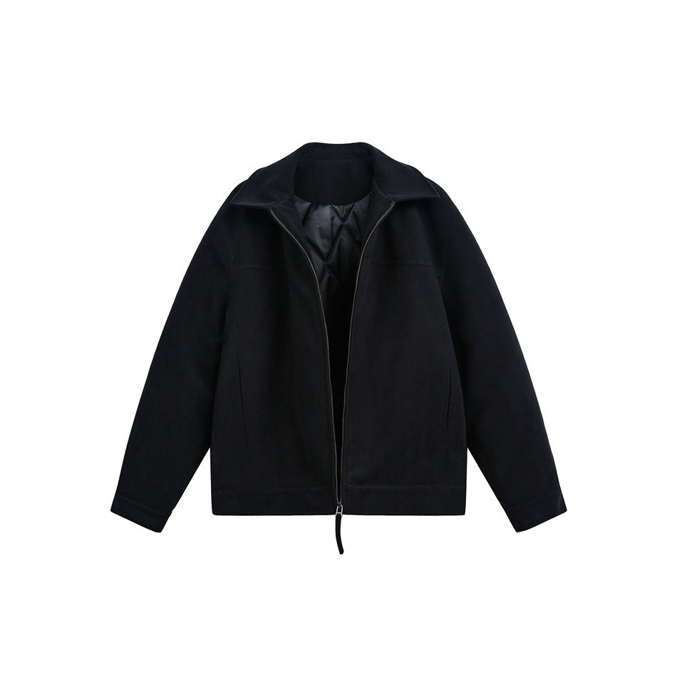 Front view of a black zip-front jacket with a wide collar and black quilted lining.