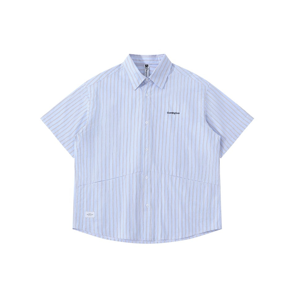 Front view of a pale blue short-sleeve button-up shirt with thin vertical stripes and small chest embroidery.