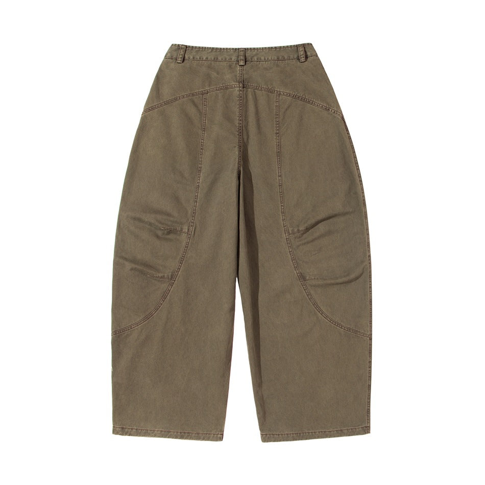 Back view of muted brown wide-leg pants with belt loops and curved panel seams.