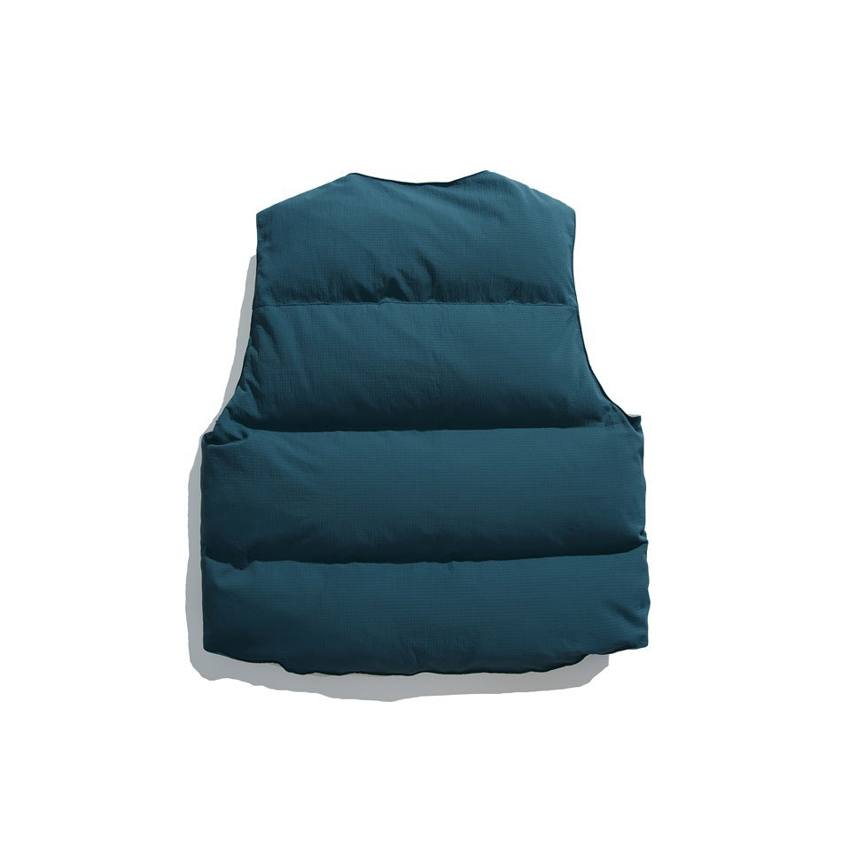 Back view of a teal padded vest with horizontal quilted sections.