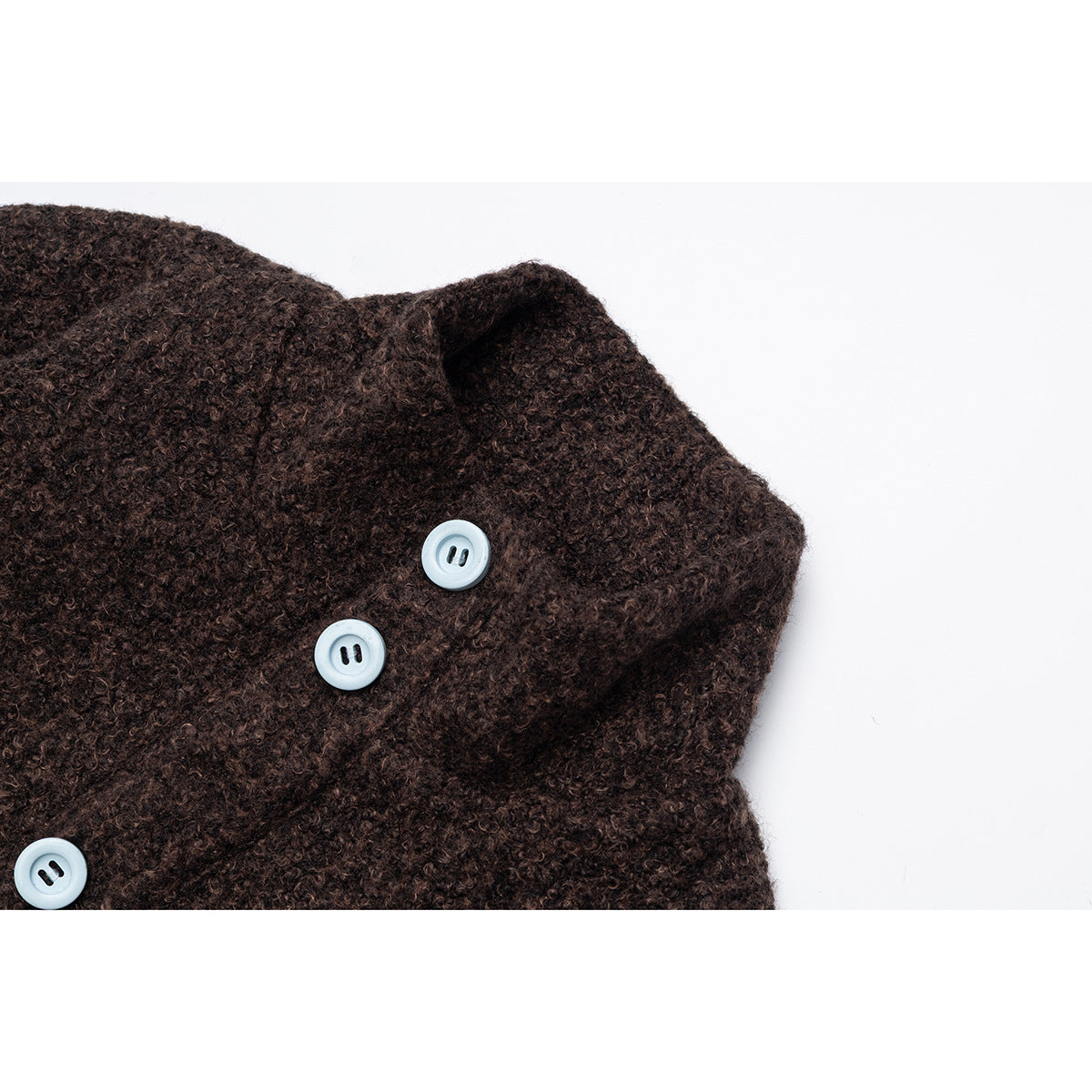 Close-up of a dark brown textured jacket collar with three pale blue buttons.