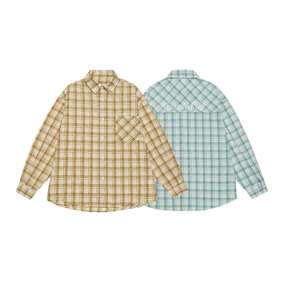 Two plaid shirts shown front and back: mustard-and-cream at front and pale blue-and-white at back, with script across the