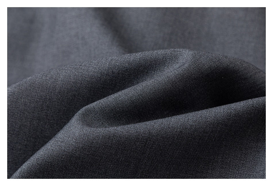 Close-up showing the surface texture and drape of charcoal gray fabric.