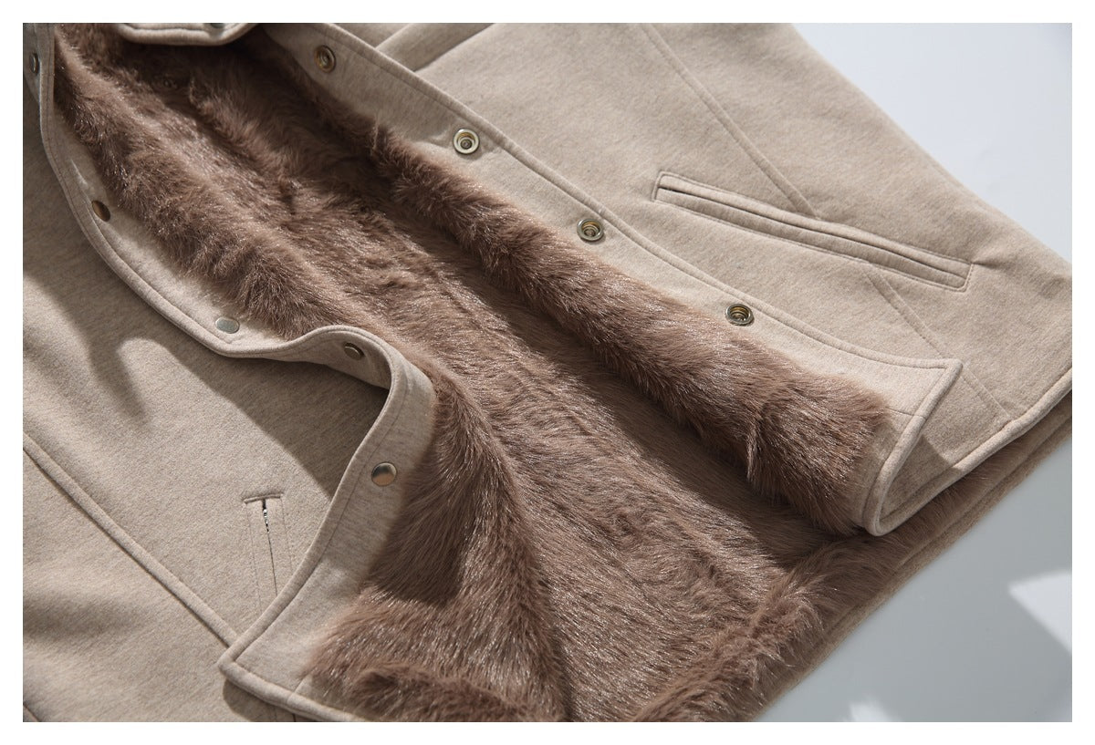 Close-up of the open vest showing its plush brown lining, snap fasteners and welt pocket.