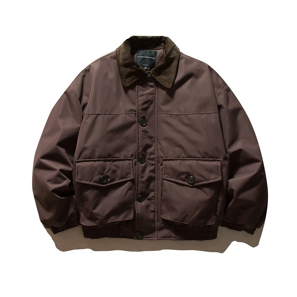 Dark reddish-brown bomber-style jacket with corduroy collar, button front, two flap pockets and ribbed hem, flat lay