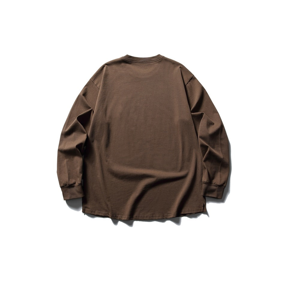 Back view of brown long-sleeve crew neck tee flat lay with ribbed cuffs and curved hem