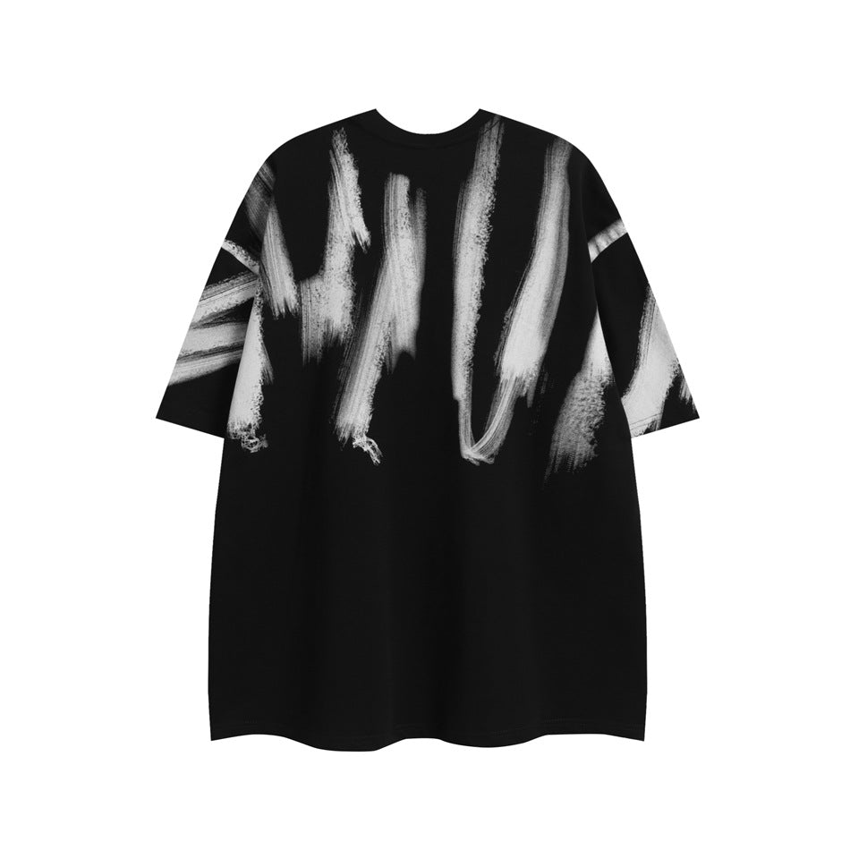 Front view of a loose black T-shirt with large white brushstroke graphics.