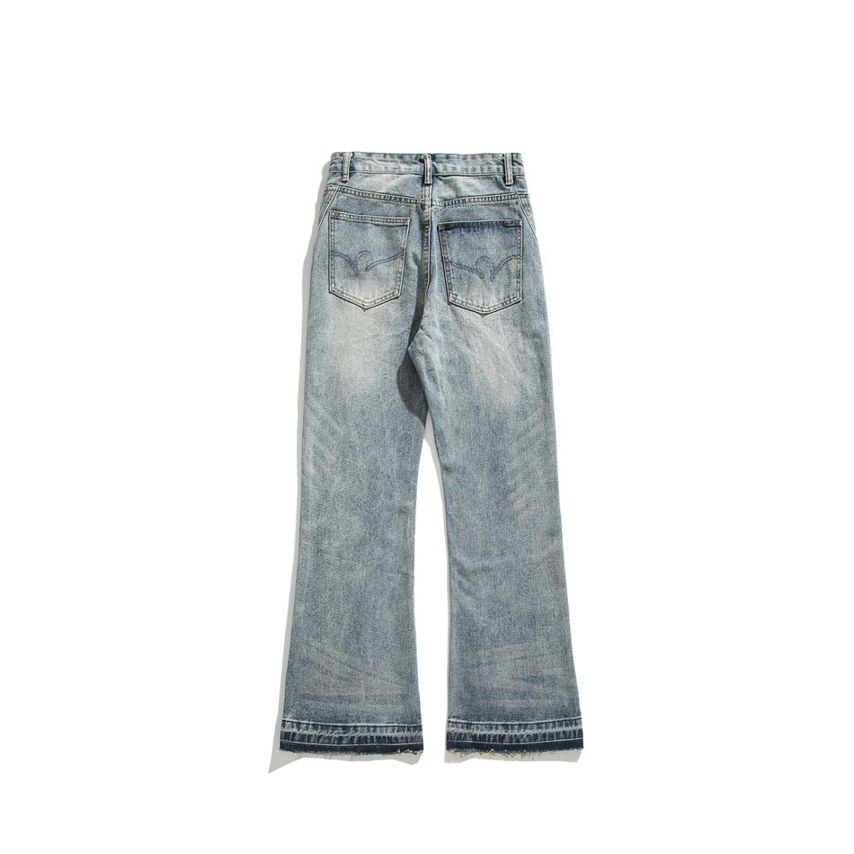 Full back view of light-wash flared jeans with two back pockets and unfinished hems.