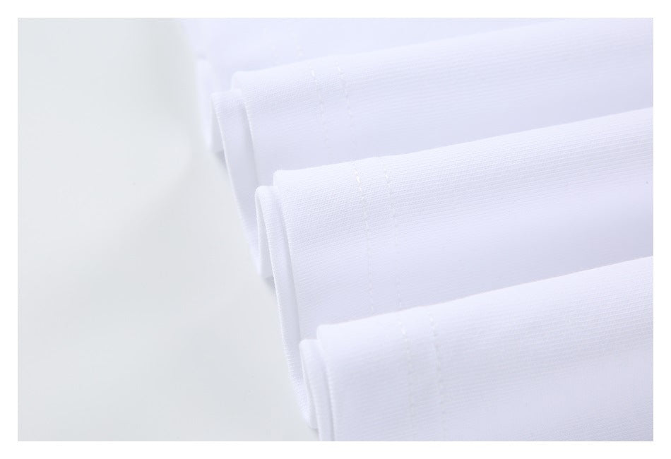 Several folded white garment edges with visible rows of stitching.